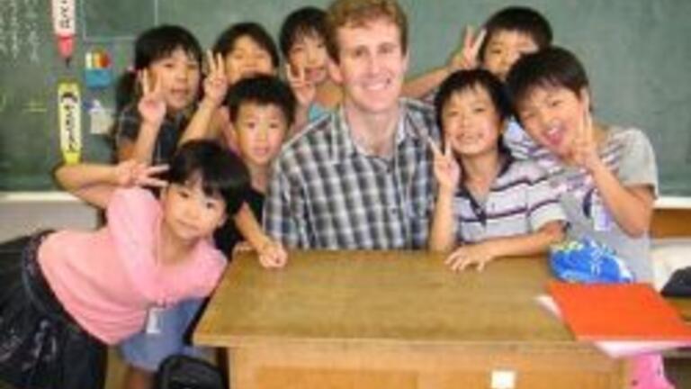John Driza with his class in Japan