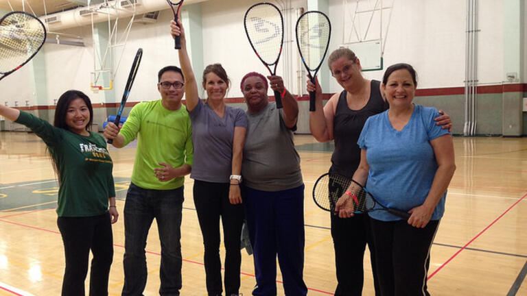 USF faculty and staff playing squash during lunch.