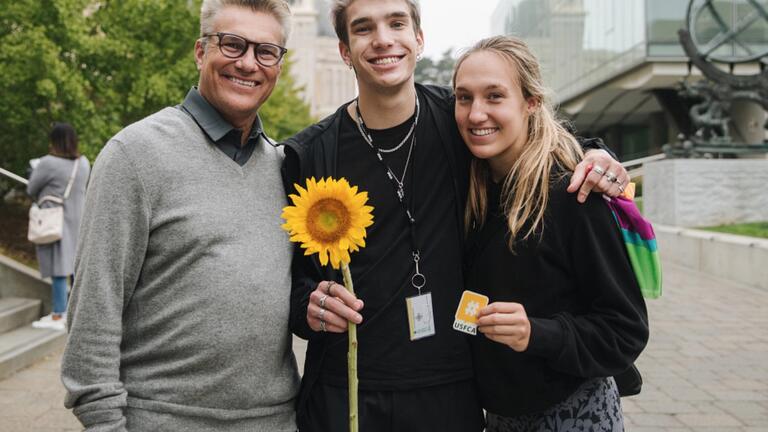 Willy Stout, center, with his parents