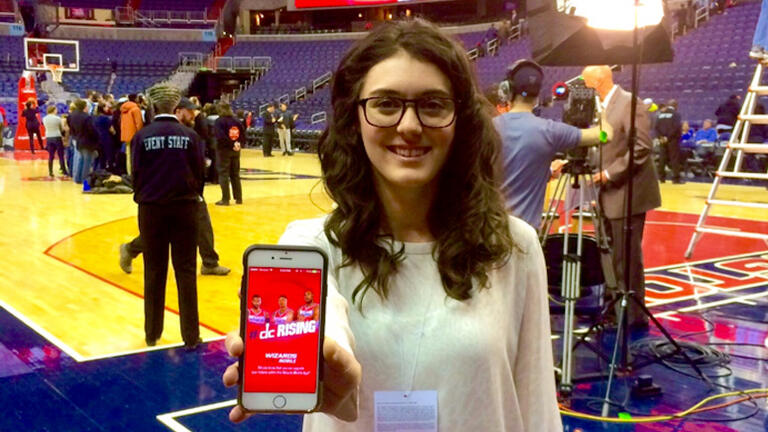 Atwell, '13, testing the in-arena features of the Washington Wizards fan app.