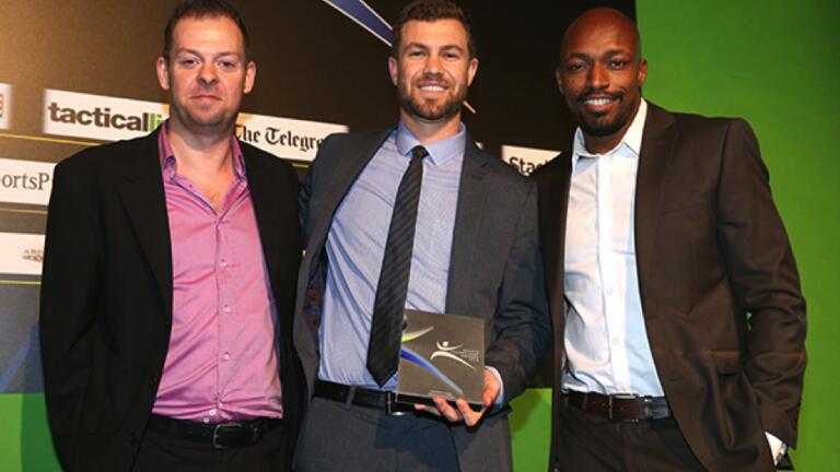 Drobny, '12, (center) and coworkers after receiving the Sports Technology Award for Best Sports App