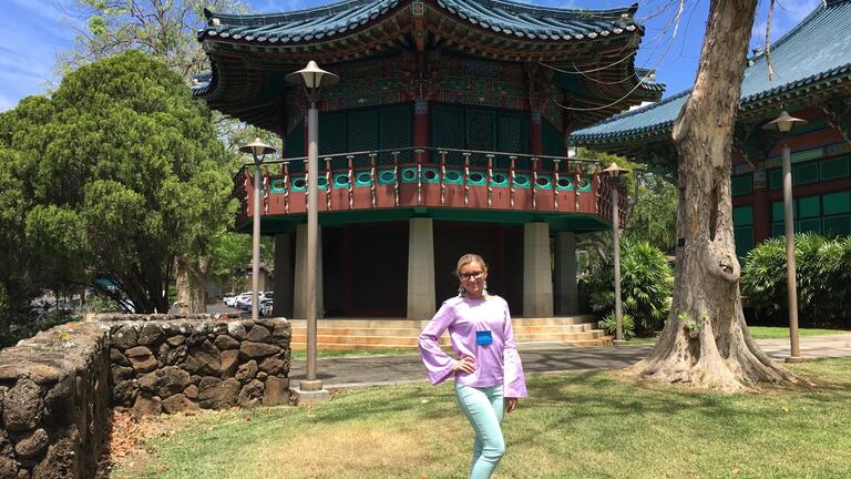 Karina Salomatina posing in front of building