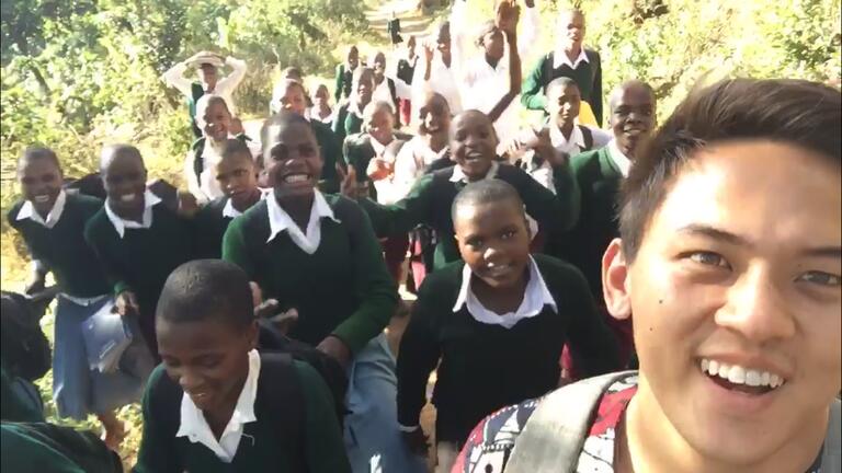 Cameron Michel '18 (foreground) with his students at his Peace Corps position in Tanzania, 2019.