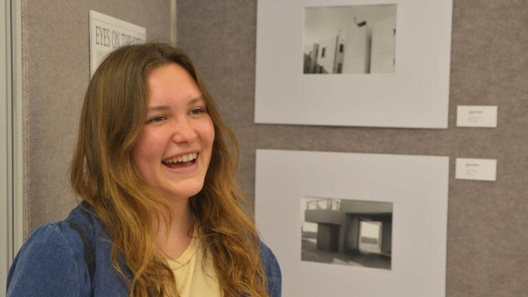 Student at the "Eyes on the City" exhibition