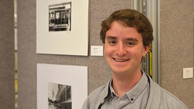Student at the "Eyes on the City" exhibition
