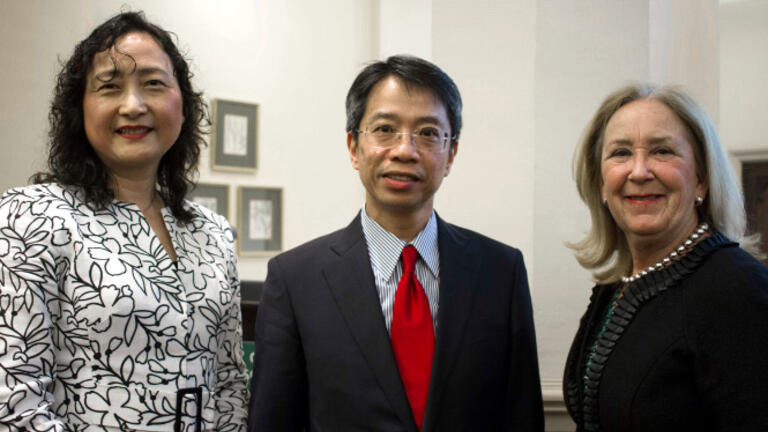 Three participants pose for a photo