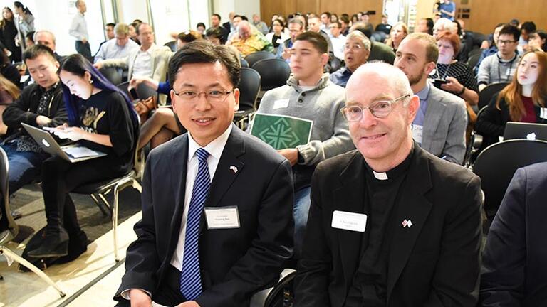 Deputy Chinese Consulate General of San Francisco Faqiang Ren left and USF President Paul J Fitzgerald SJ