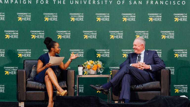 Professor Sonja Martin Poole speaking with Kevin Johnson on stage