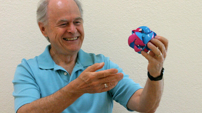 Benjamin Wells, mathematics and computer science professor, with the Fusion Project's mascot, the Switch-Pitch. Photo by Margaret Mayer.