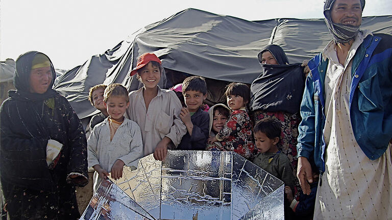 Portable solar cookers for free to refugee families in Afghanistan.