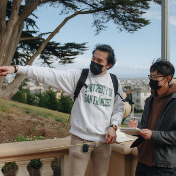 Architecture students take measurements on Lone Mountain steps.
