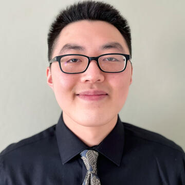 Student poses for photo wearing a tie