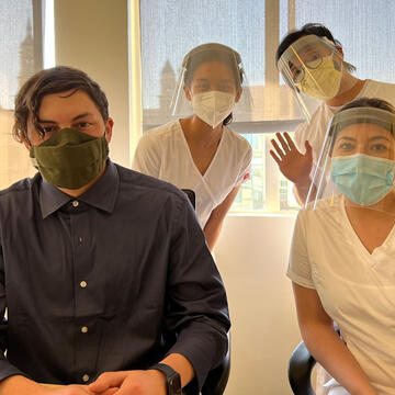 Group of nursing students in masks and protective gear.