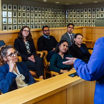 Student presents to a jury in moot court.