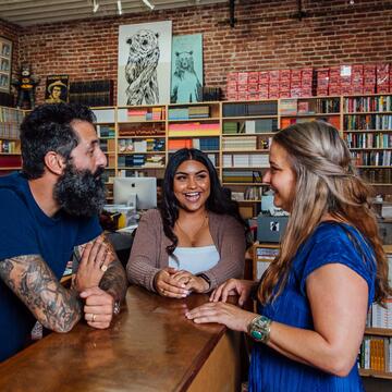 Staff and students chat in the bookstore at Dave Eggers' nonprofit 826 Valencia.