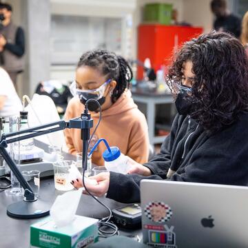 Students take measurements in a lab class.