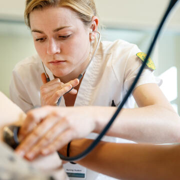 student in the sim lab