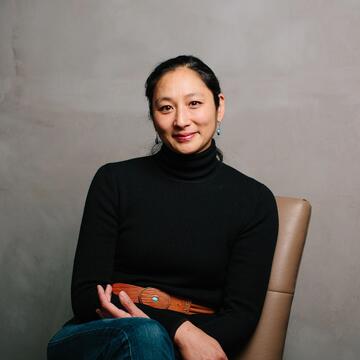 Hana Mori Bottger sits in chair