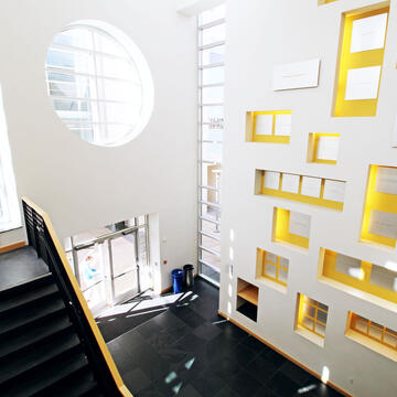 Lobby of Zief Library with a wall of colorful boxes.