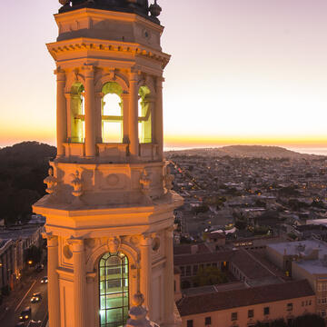 St Ignatius Church tower and sunset over the coast.