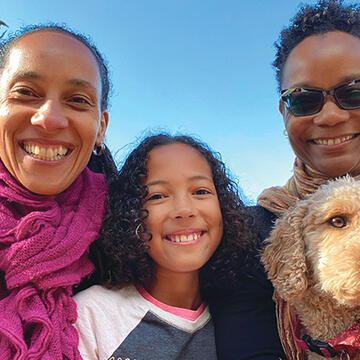 Chinyere Oparah, Onyeka Oparah, Shawn Nealy-Oparah, and Chizara, the mini labradoodle.