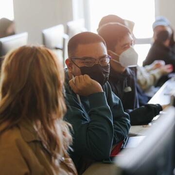 Students chat in a computer lab