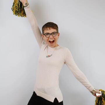 April Crabtree poses with pom poms