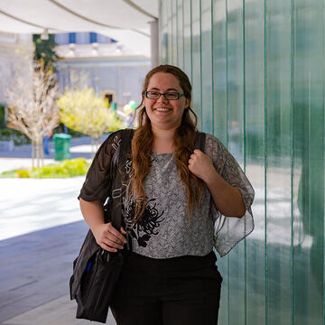 Law student standing on campus.