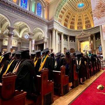 Graduates line the pews in St Ignatius church.