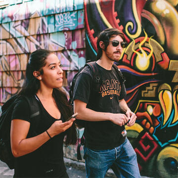 Students view murals on a Mission district walk