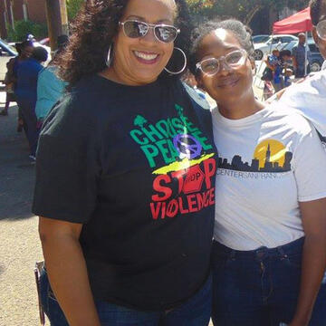 Adrian Owens with volunteer at an event