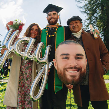 Thomas Ostrowski celebrating graduation with loved ones.