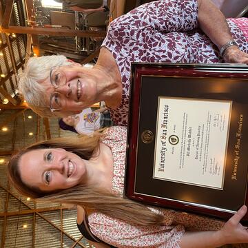 Jill Wabbel and her grandmother holding a diploma