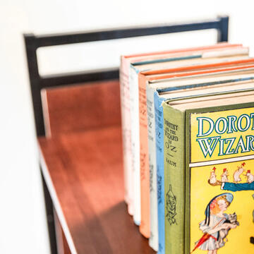 Wizard of Oz rare books on a cart