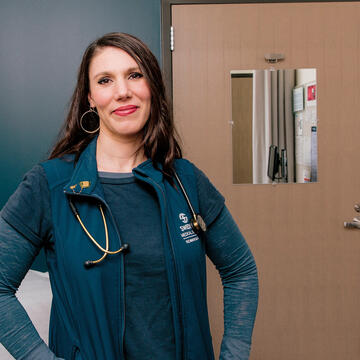 Laura Sabin poses in a hospital room