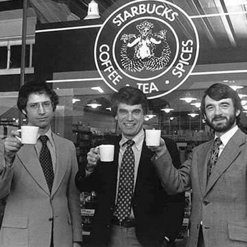 Starbucks founders cheers in front of Seattle store in 1979.