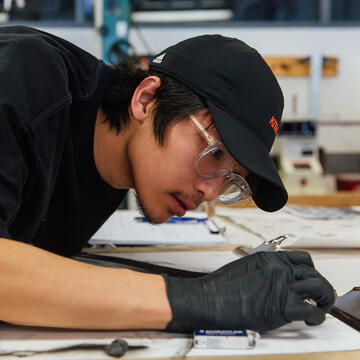 student working on a drawing