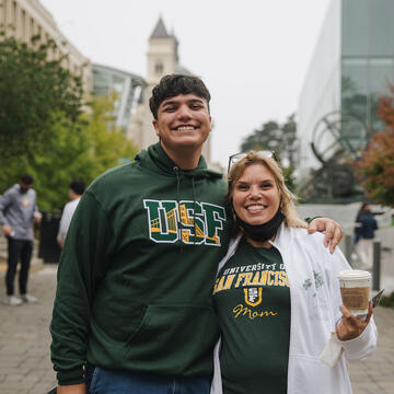 Student and mother in matching USF shirts