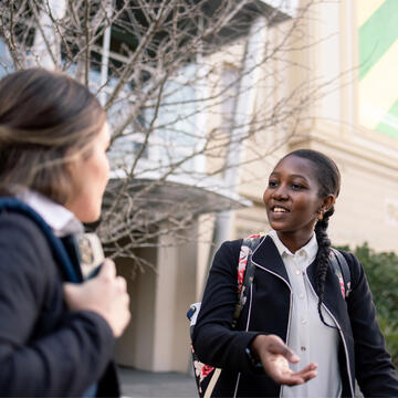 USF student walking on campus with friend