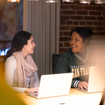 two students working together in class