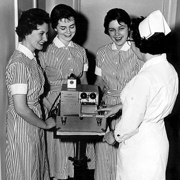 1960s nurses laugh together