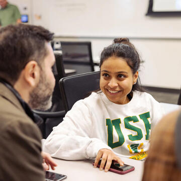 USF students chatting in class