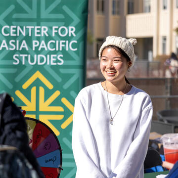 USF student working a booth at the lunar new year celebration