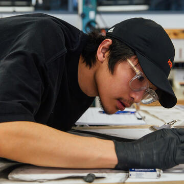 student creating a drawing