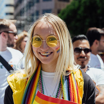 usf student smiling outside during pride parade in San Francisco