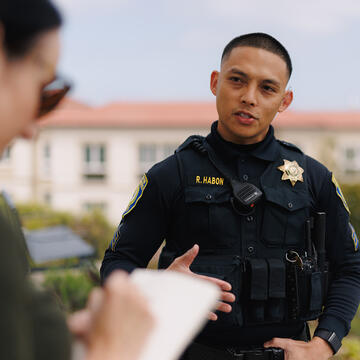 Sgt. Ray Habon speaks with a reporter