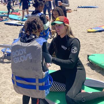 Adriana Guerrero-Nardone with girl at beach