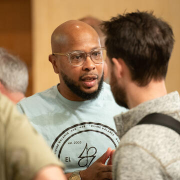 Leon Benson talks with SOL student Jacob Gromanz
