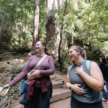 students walk together in the woods