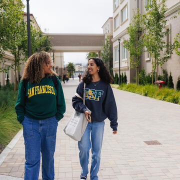 students walking outside on campus
